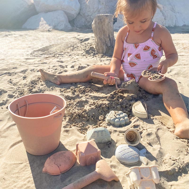 baby_playing_with_blush_beach_toys_at_the_beach